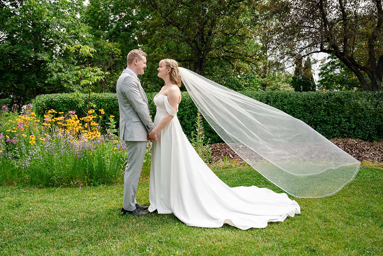 erin-eric-flower-field-portrait Portrait in front of the wildflower garden at Smeltzer House