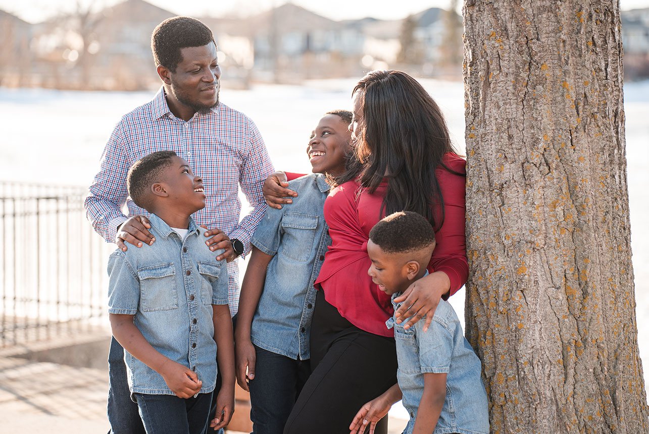 Family outdoor spring photo session in St. Albert with three young boys and their mom and dad, captured by Catriona Hope Photography