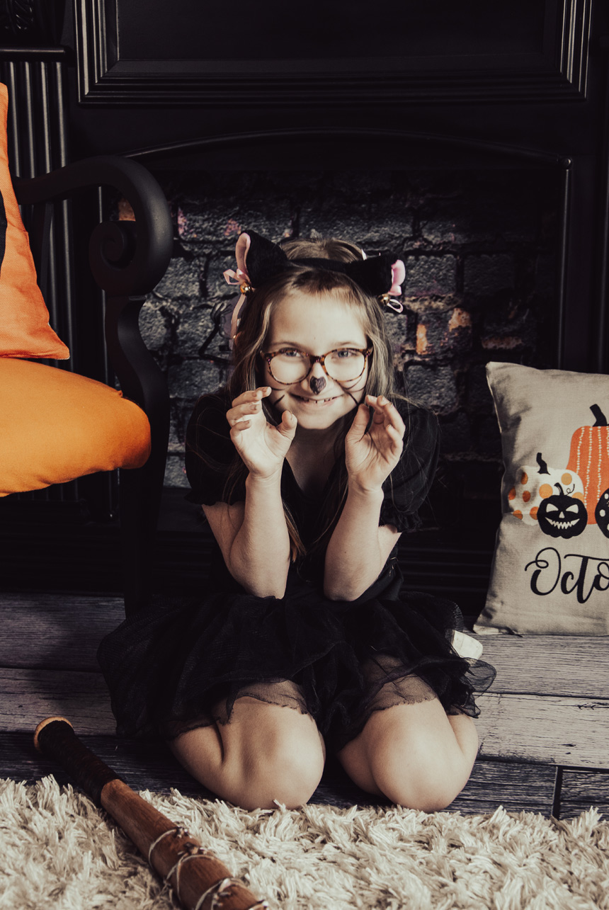 Halloween-girl-dressed-as-a-Cat-woman-with-bat-in-Sherwood-Park-Photo-Studio