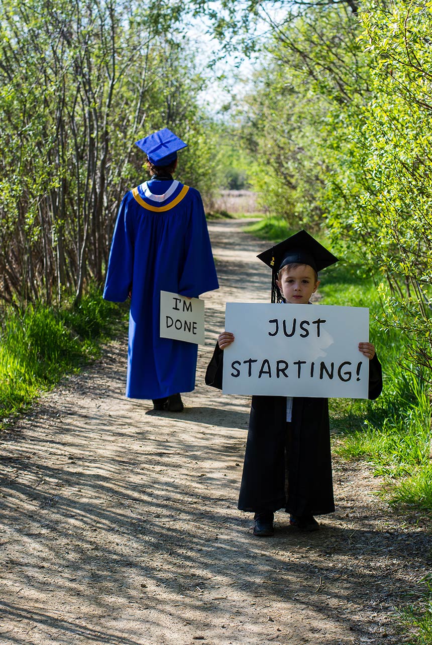 Just starting school sign with a graduate I'm done sign