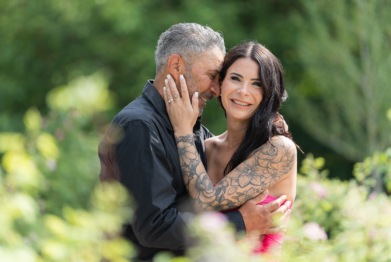 Couple embraced at EHS Gardens near Muttart Conservatory in Edmonton