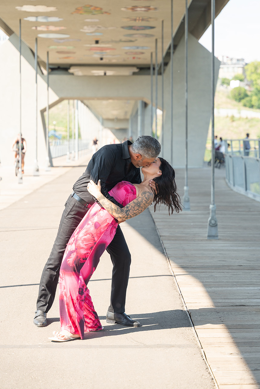 tawatinâ-bridge-edmonton-engagement-kiss-dip Groom dips fiancée for a kiss beneath Edmonton’s Tawatinâ Bridge