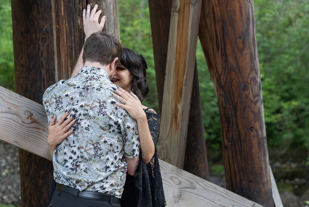 romantic-couple-under-trestle-bridge-mill-creek-edmonton