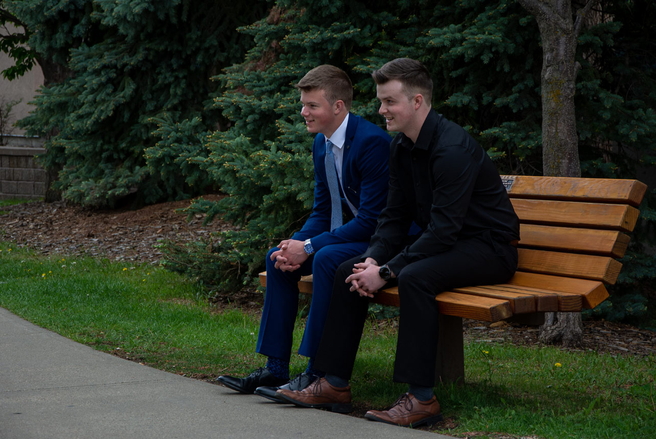 Two-2021-Graduates-on-a-park-bench